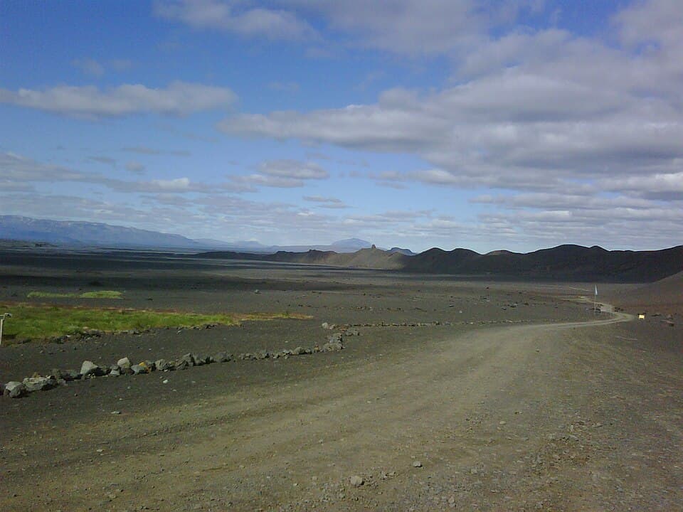 The Kverkfjallaleið track running across black volcanic desert in the Icelandic interior