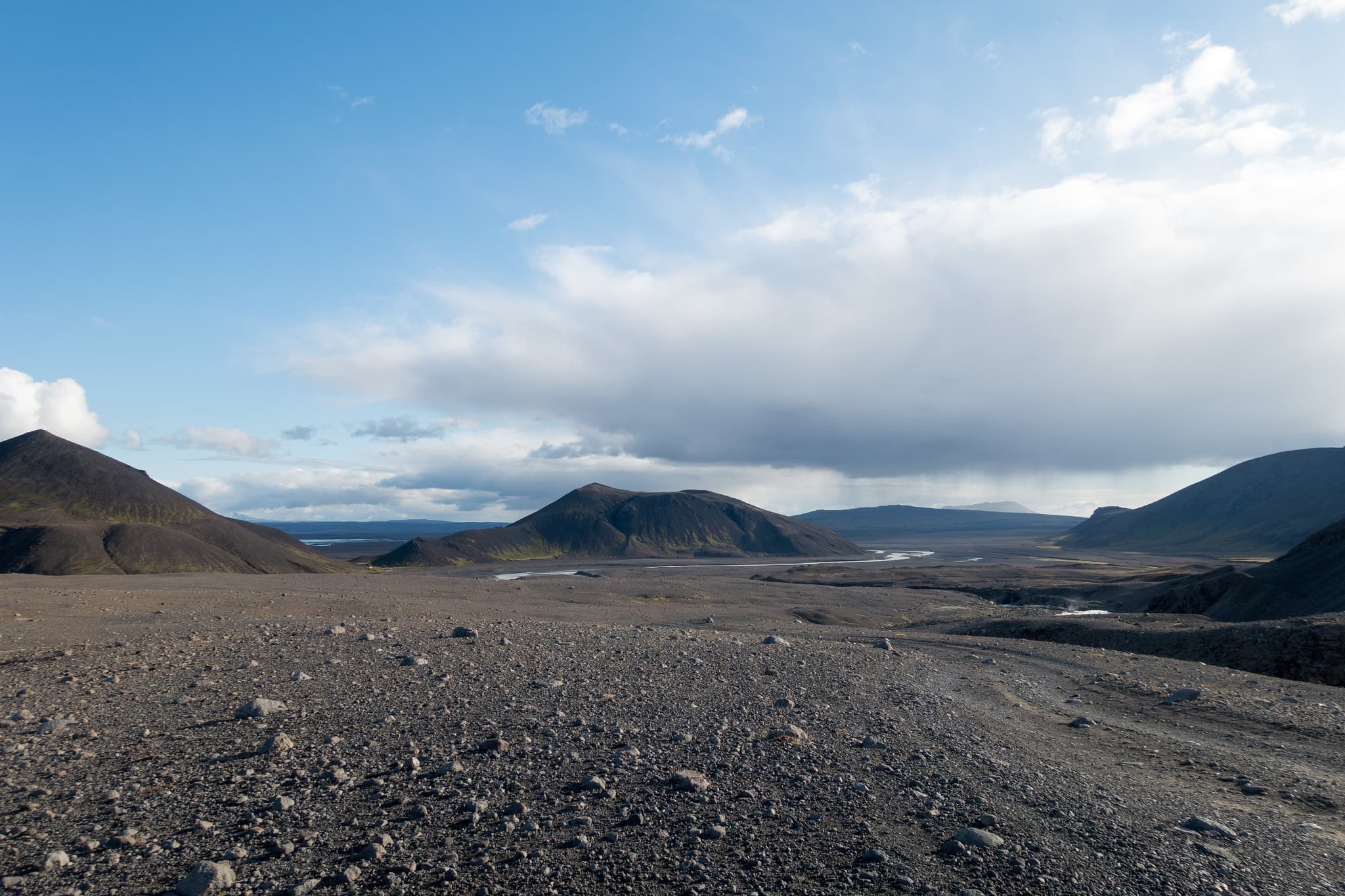 A long gravel highland track under open sky in Iceland