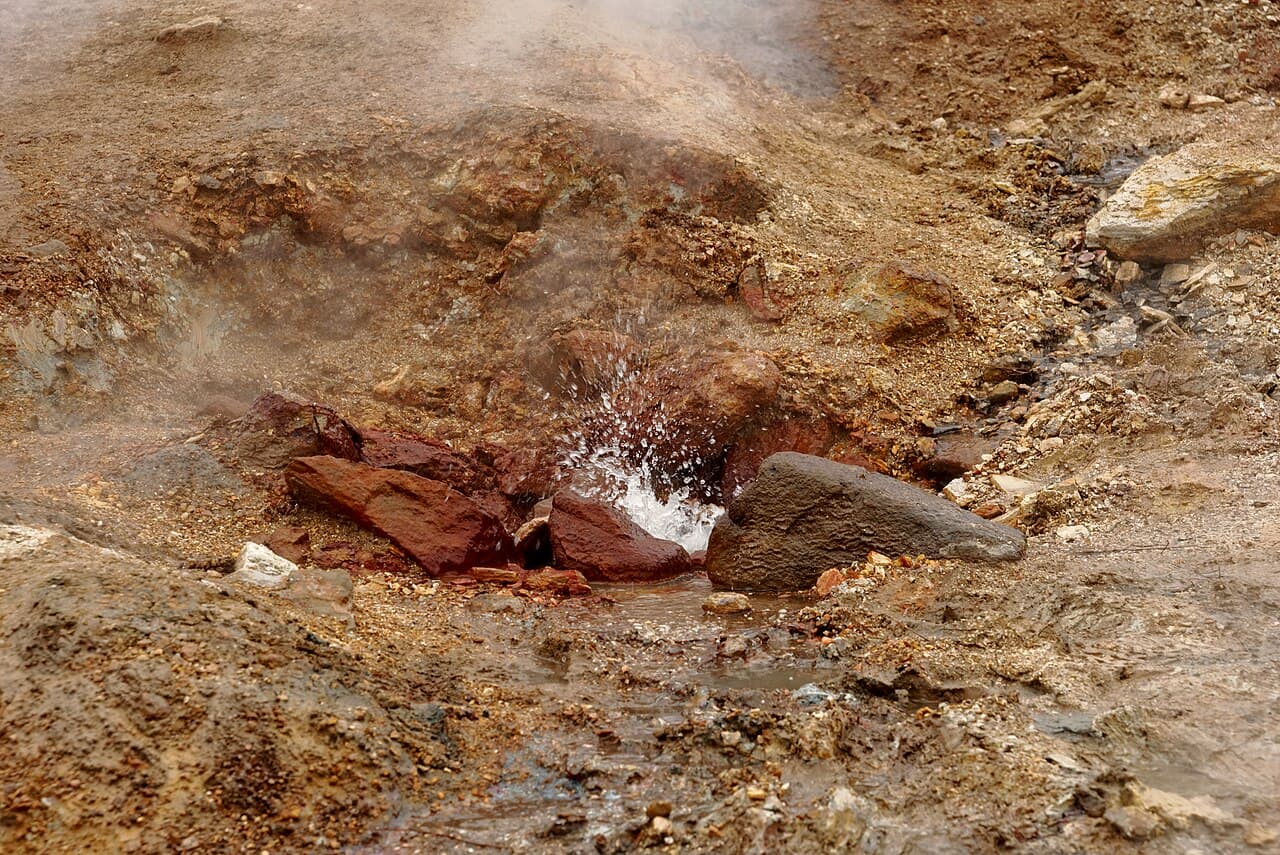 Steam rising off a hot spring in the Reykjadalur valley, Iceland